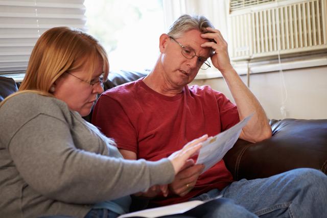 couple reading a paper